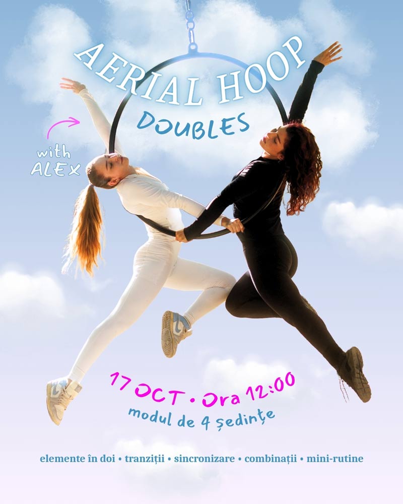 two women in a aerial hoop pose